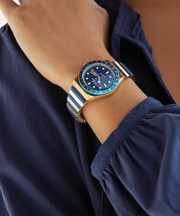 montres | Q Timex femmes Malibu - Montre à bracelet extensible en acier inoxydable de 36 mm R2F20335 doré/bleu